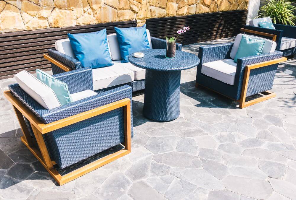 patio featuring two cozy blue chairs adorned with stylish throw pillows